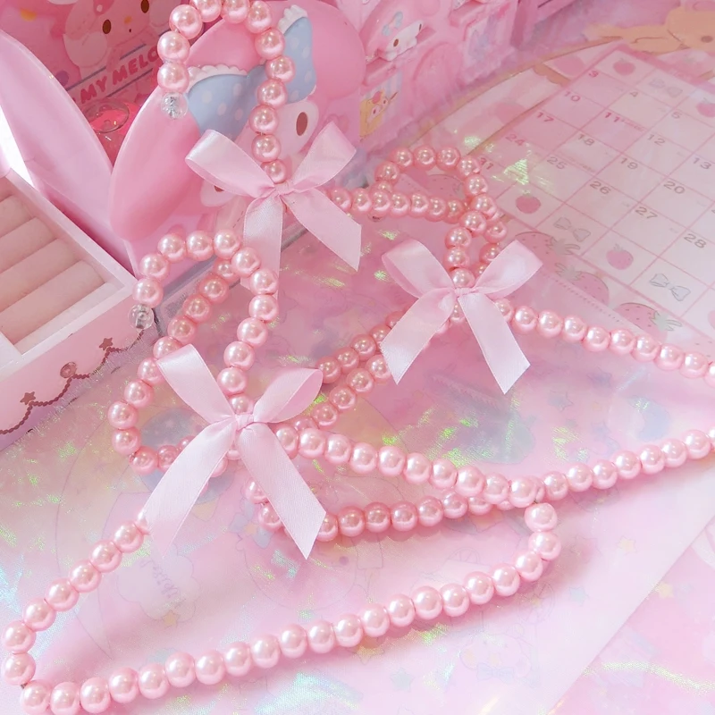 

1pc Lovely Pink Pearl Bow Clothes Hanger Rack Plastic Towel Dolls Clothes Display