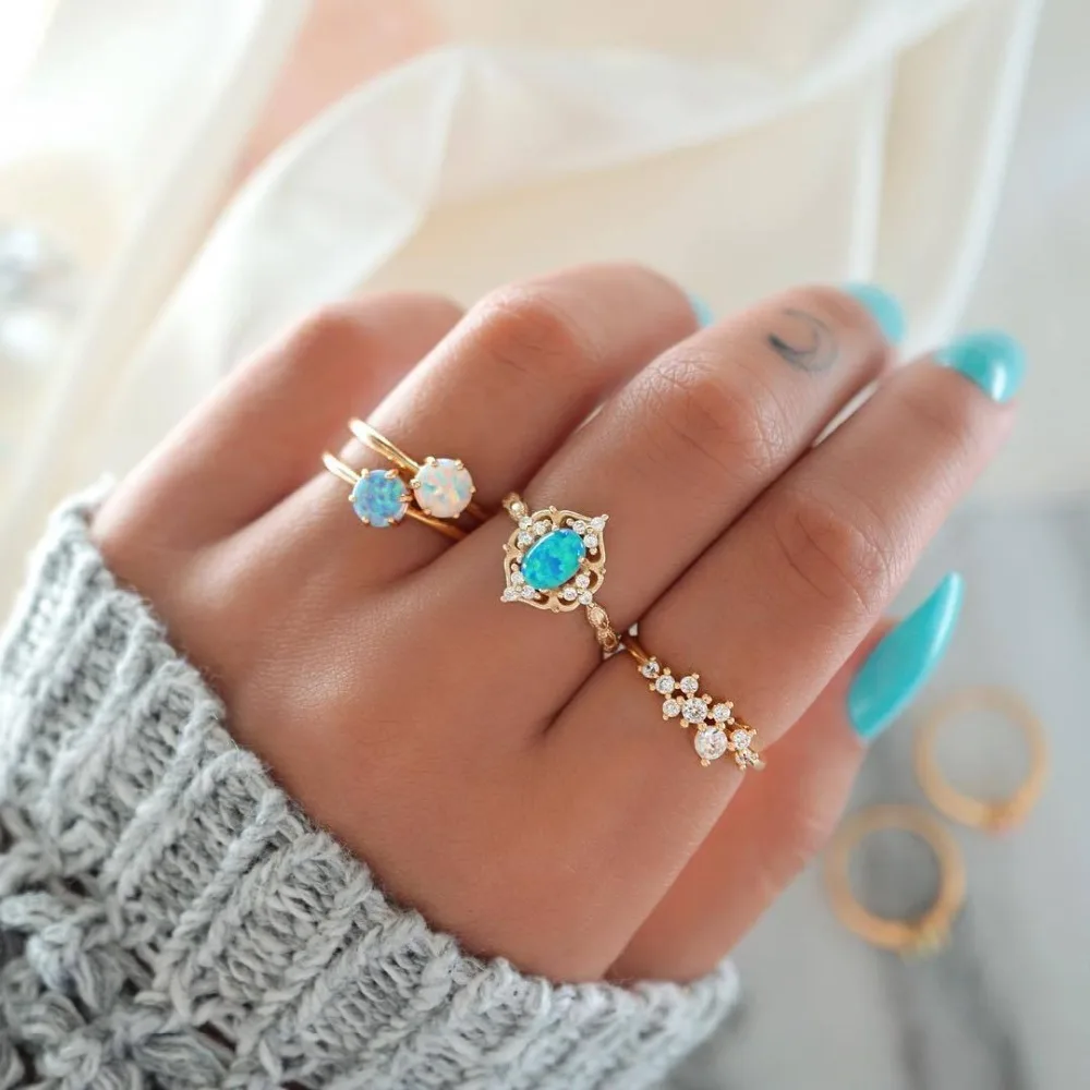 

pack of 4 exquisite creative knuckle rings with inlaid rhinestone and opal design in gold tone