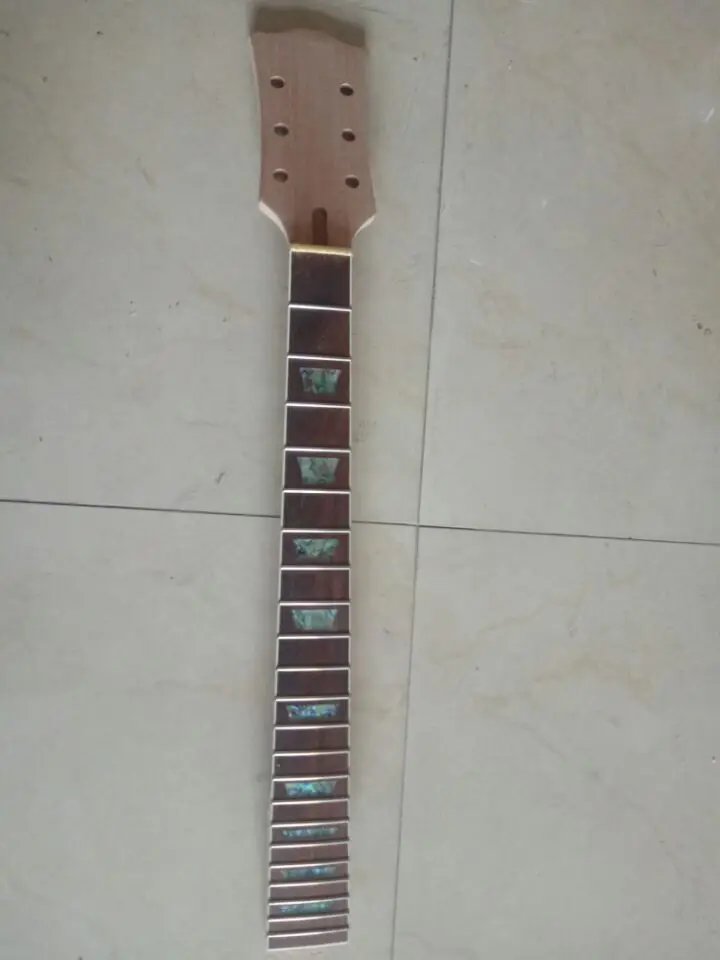 

Unfinished guitar neck studded with colored shellfish guitar neck
