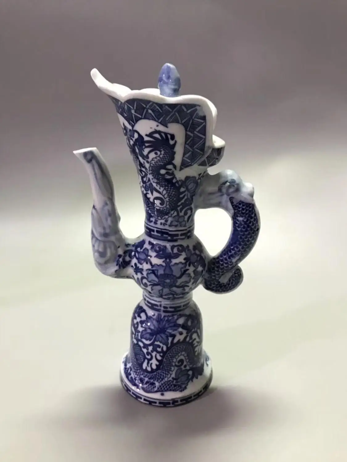 

Chinese old porcelain Dragon shaped kettle with blue and white porcelain