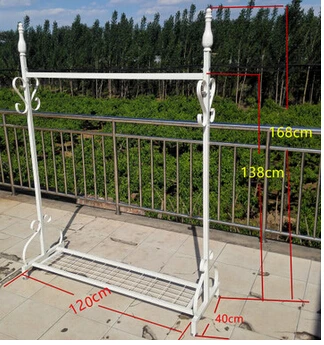 Wrought iron clothing store display shelf. Console clothes rack. Clothing racks display shelf.