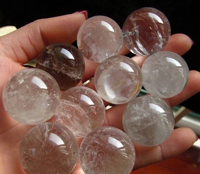 

A 2426mm 10pc diameter natural mineral quartz rock crystal sphere (0601)
