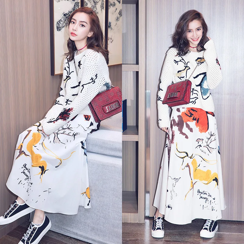 

New 2019 Skirt Suit with Hollow Knitted Sweater and Printed Half length Skirt in the Autumn