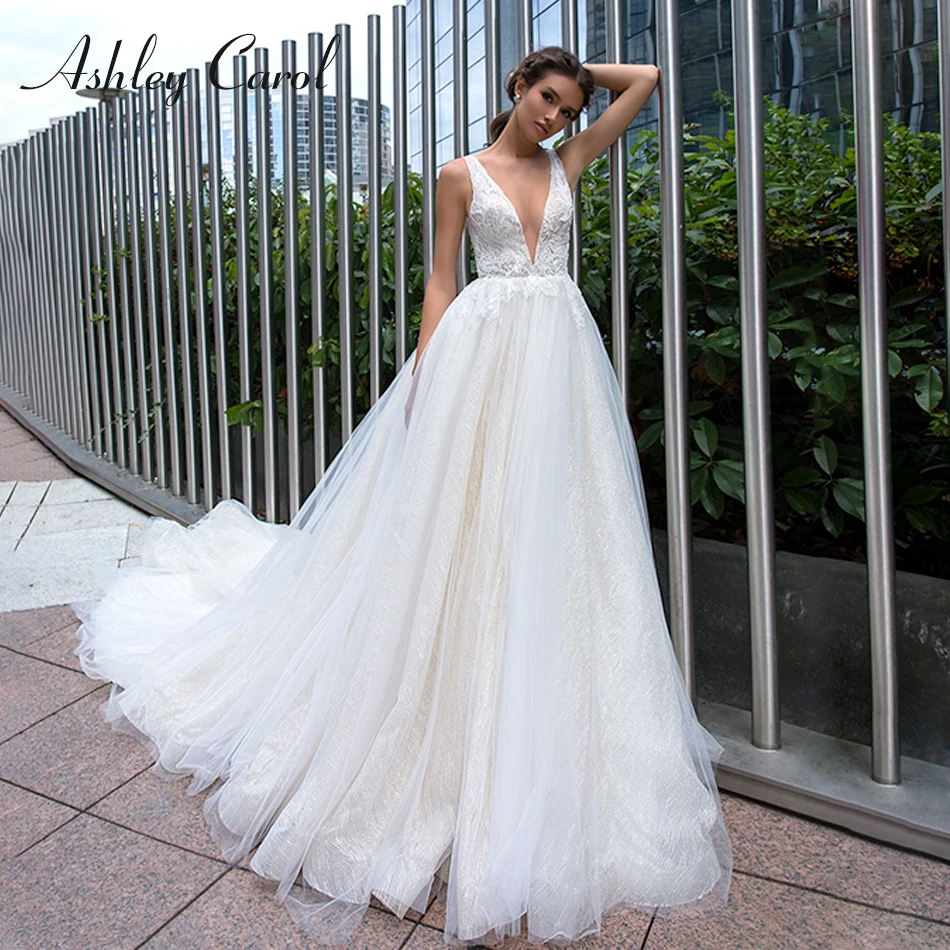 

Ashley Carol Luxury Beaded V-neck Sexy Backless Princess Wedding Dress 2019 New Arrival Sleeveless Chapel Train Wedding Gowns