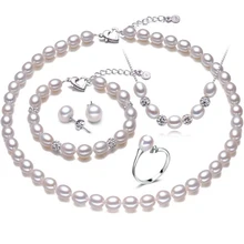 Forma de arroz perla real de cuatro piezas traje accesorios anillo colgante y pendientes de la boda o de la joyería del partido de las mujeres
