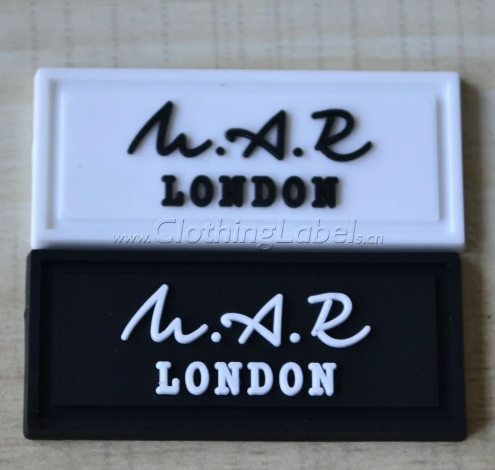 custom PVC rubber label with embossed logo and groove line for sewing