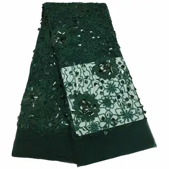 

Emerald green, high quality large sequined lace fabric of lacy fabric with colorful Latin clothing net and a major holiday party