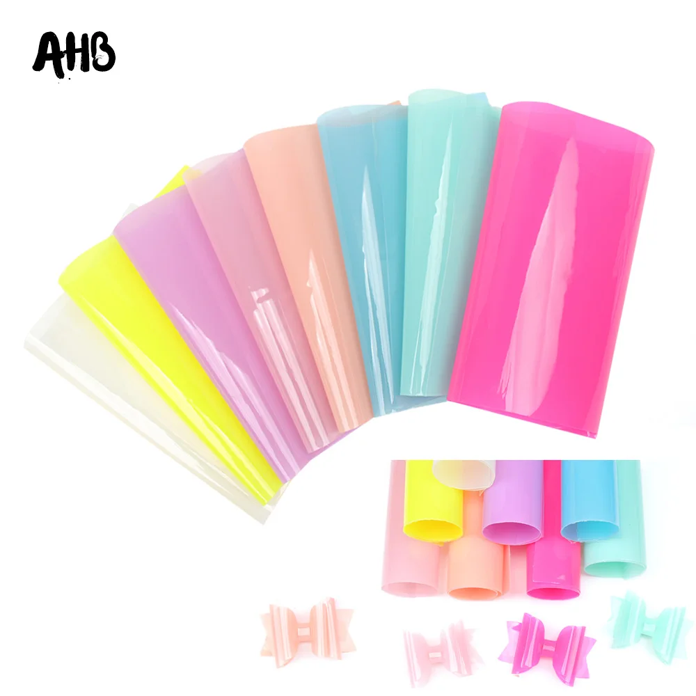

AHB 22*30cm PVC Laser Fabric Synthetic Hologram Shiny Star Transparent PVC Vinyl Fabric Party Decoration DIY Fabric For Bow
