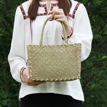 

The new straw bag Korean version of the women's mats woven cloth retro art package shoulder bag rattan table beach package