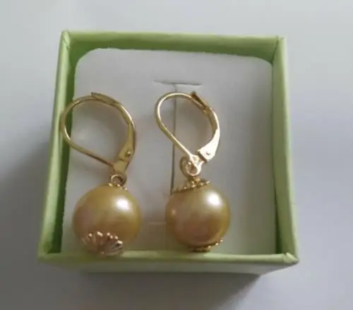 

a pair of 10mm natural south sea gold pearl earrings 14K/20 gold hoop
