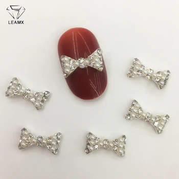 

LEAMX 10 PCS/bag Pearl Bow Nails Art Decorations 3D Bow Rhinestone Silver Metal Nail Jewelry Accessories DIY Manicure Tips L423