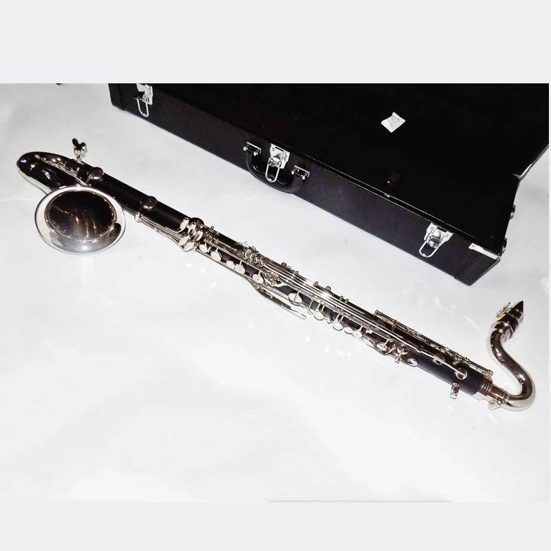 Бас-кларнет деревянный духовой музыкальный инструмент. Бас кларнет. Conn selmer кларнет. Бас кларнет диапазон. Кейс для бас кларнета.