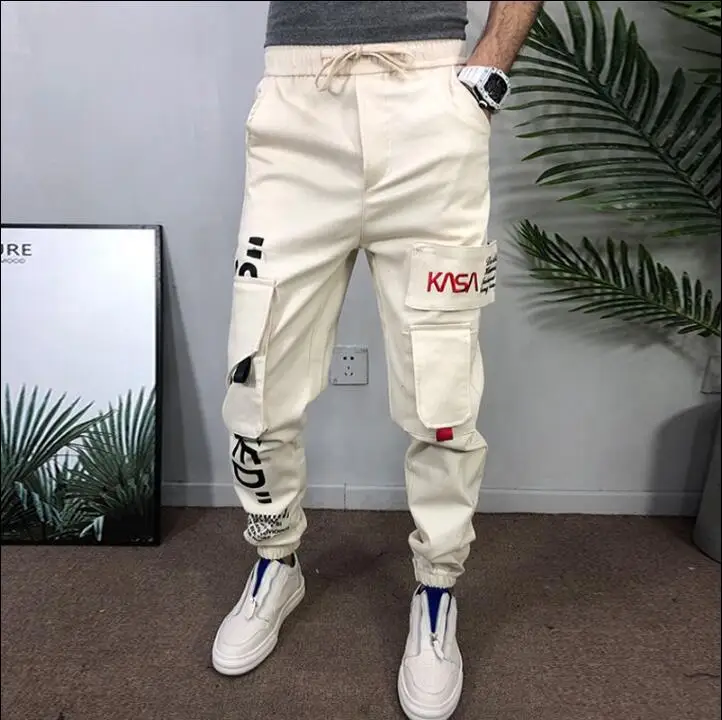 

2019 spring new men's overalls pants feet micro-block tooling fabric trend casual wild harem pants jogging