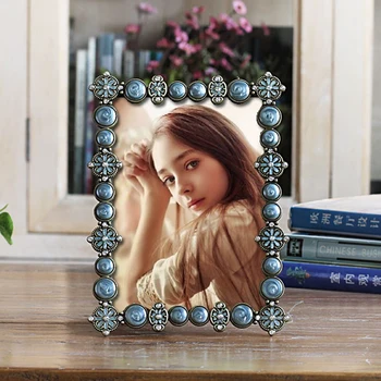 

Antique Brass Blue Hand Painted and Jeweled 5 by 7 Rectangle Shaped Metal Picture Frame