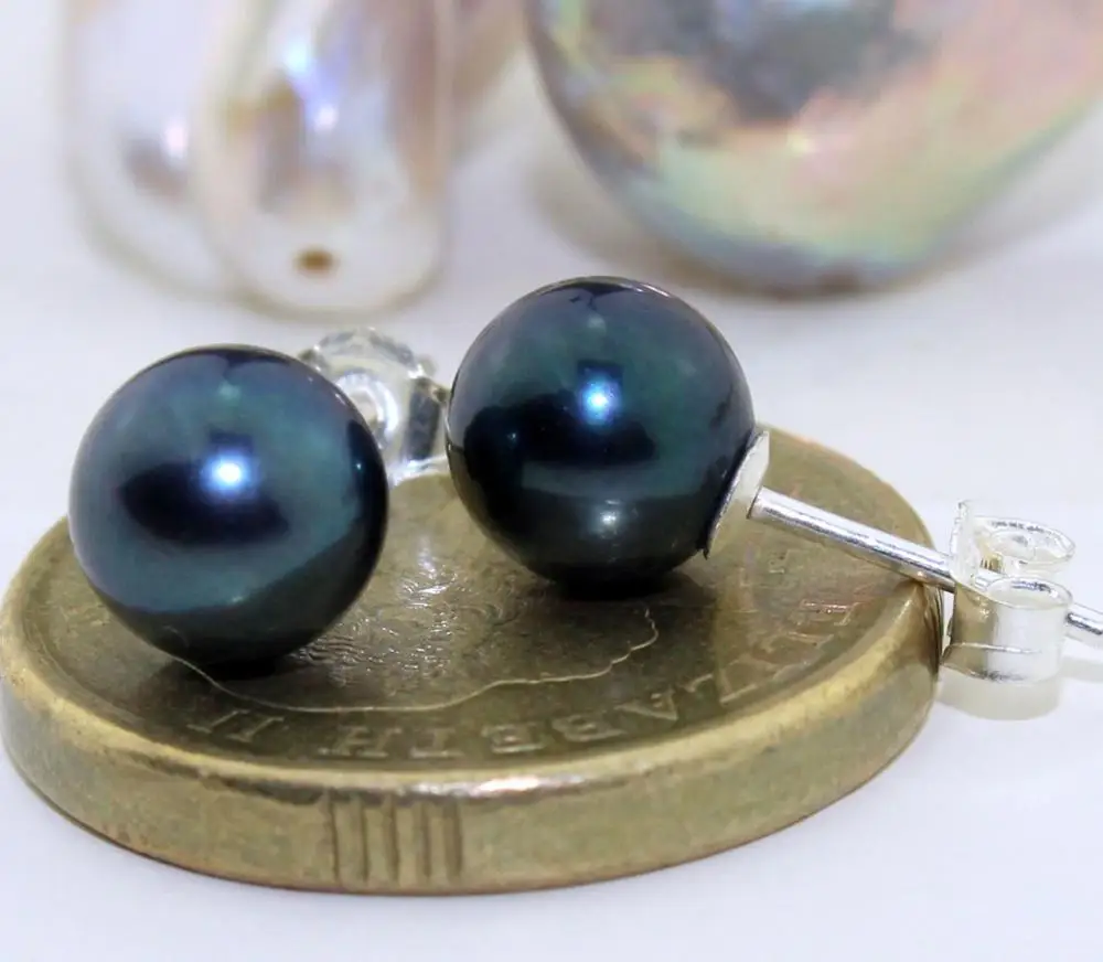 

a pair of natural tahitian black green pearl earrings silver