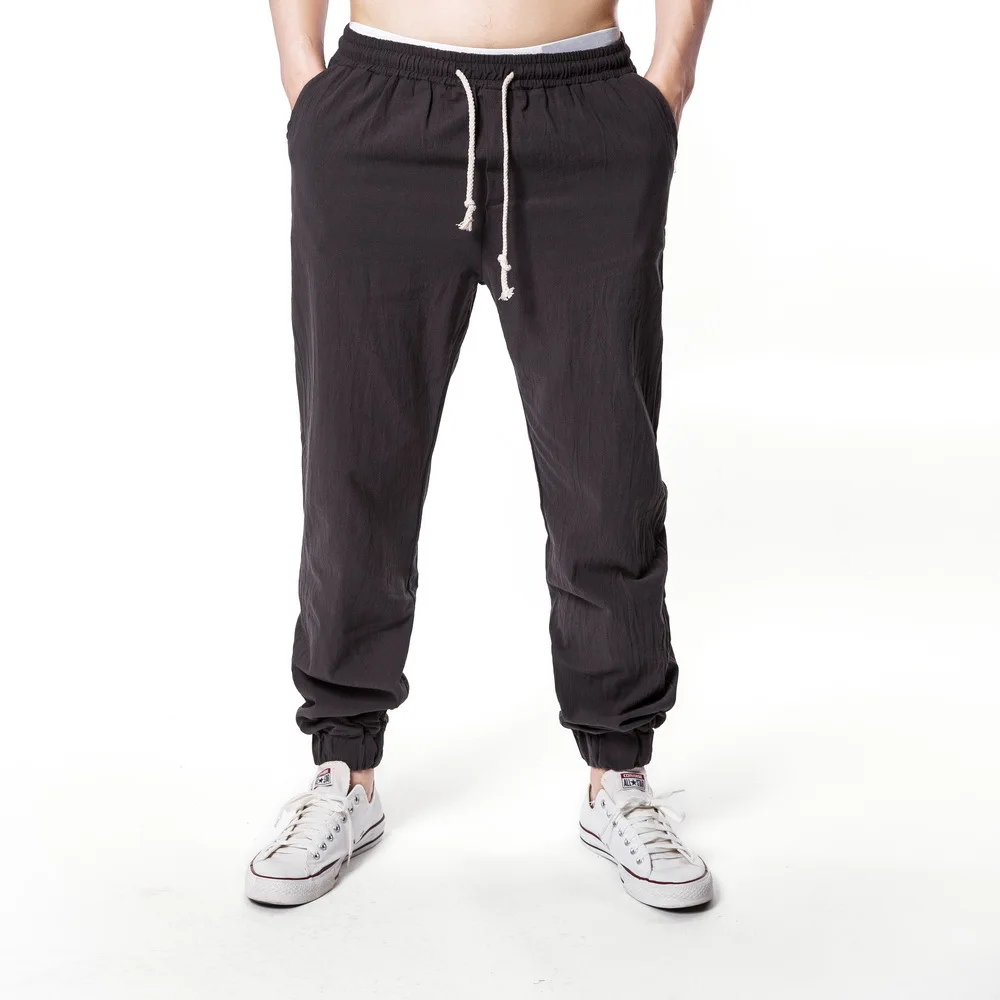 

Men's New Summer Fashion Versatile Casual Loose Solid Color Drawstring Elastic Waist Trousers