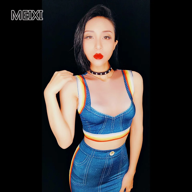 A blue denim dress with rainbow stripes serves as a