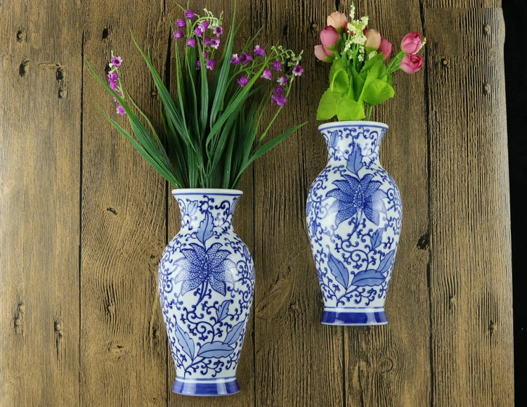 Ваза дельфт. Ваза для цветов керамика. Ваза настенная керамическая. Вазы половинки. Роспись прозрачной вазы.