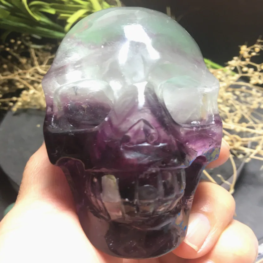 

Natural transparent with a green ghost hand-carved crystal skull aura healing