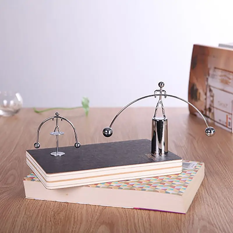 

Funny Balance Perpetual Motion Weightlifting Iron Man Toy Pendulum Newton Home Office Table Decoration
