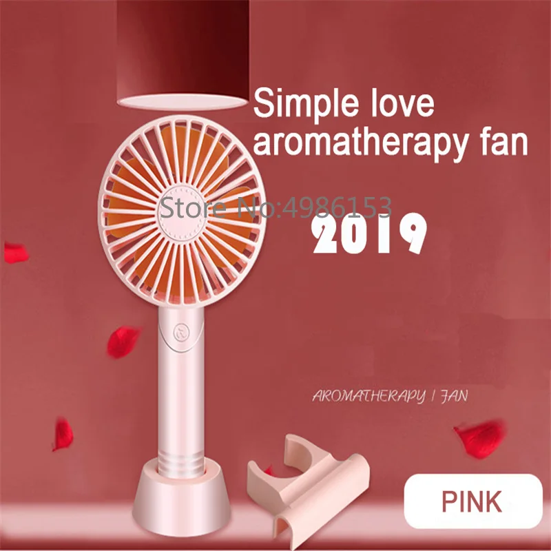 

2019 new handheld electric portable fan placed aromatherapy USB mini summer cooling three speeds can be placed mobile phone fan