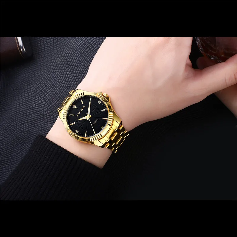 gold watch on wrist