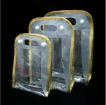 

wholesale 12*5.5*17cmFree shipping. Golden colour clear pvc cosmetic bag,hand bag gift bag.size 300piece\lot