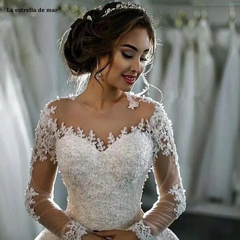 

Wedding gowns 2019 new O-Neck lace beaded long sleeve ivory color see Ball Gown bridal dresses trailing amanda novias