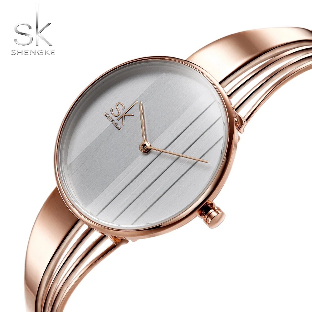 

SK New Style Fashion Unique Gold-plated Women Watch Charm Ladies Wristwatch Hollow out Bracelet Quartz Personality Watch Women