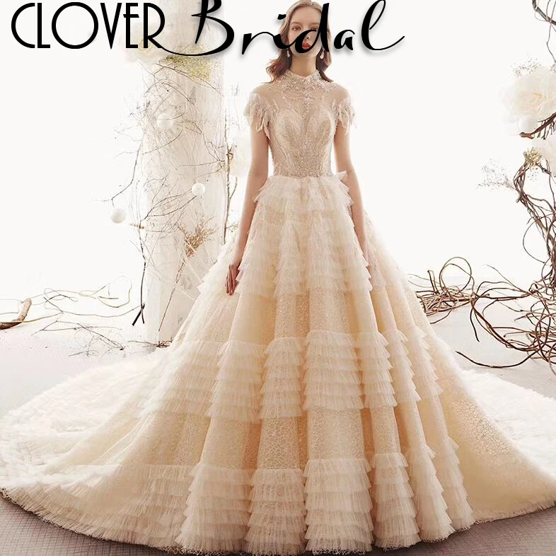 

CloverBridal expensive high end multi-layers ruffles skirt soft tulle lace illusion sleeves light champagne bridal wedding dress