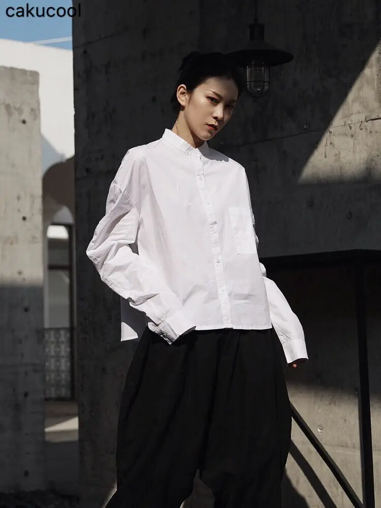 

Cakucool 2019 spring and summer new port wind original personality white simple arc shape loose neutral long-sleeved shirt