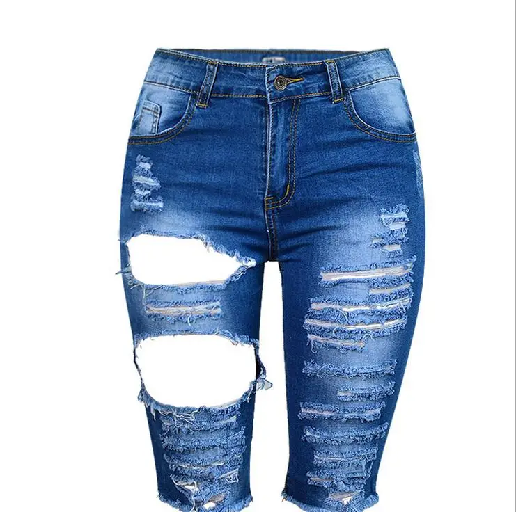 black jeans with holes in them