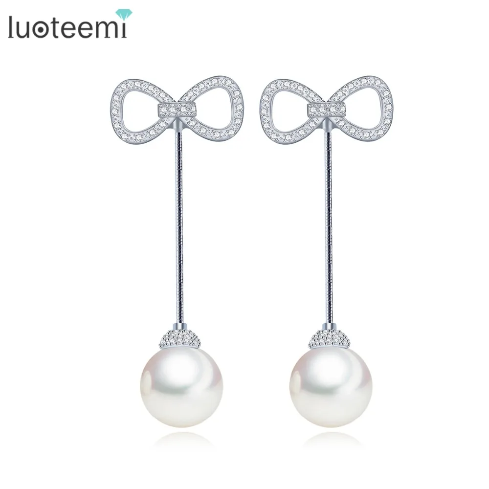 

LUOTEEMI New Design Temperament Simulated Pearls Earrings CZ Bowknot Ear Stud White Gold-Color Long Brincos for Women Jewelry