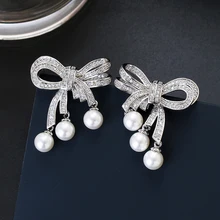 Серьги с бантиком и жемчугом, высокое качество, CZ камни, проложенный медный с золотым покрытием, серьги-гвоздики, ювелирные изделия XIUMEIYIZU