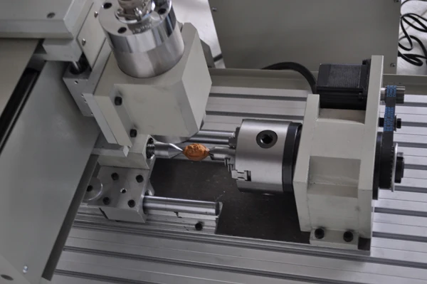 

Three-dimensional carving olive wood ornaments factory direct engraving machine CNC engraving machines small nuclear