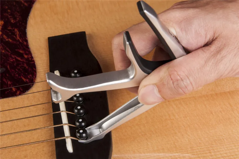 

JOYO JCP-02 Durable Silver Metal 3 In 1 Multifunction Guitar Capo Bottle Opener Guitar Bridge Pins Puller&JOYO Jazz Guitar Picks