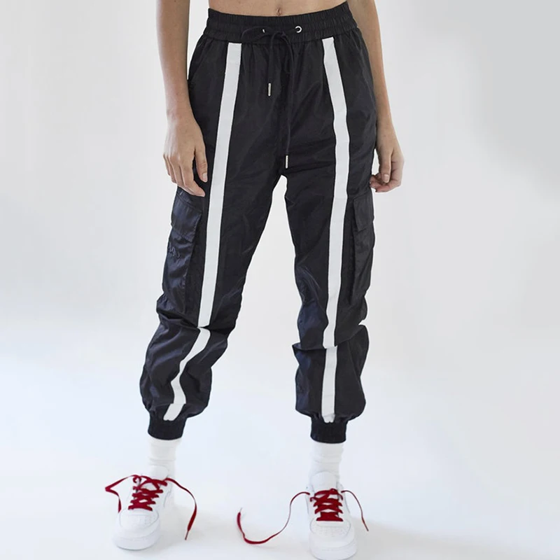 women's black track pants with white stripe