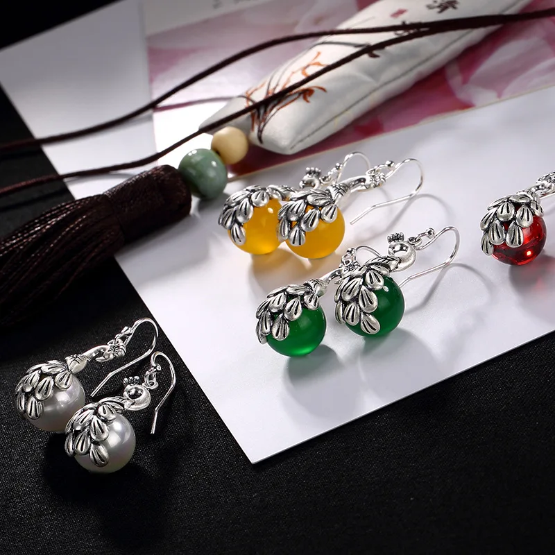 

Ways Is Yellow Green Chalcedony Pearl Pomegranate Red Inlay Peacock Pendant Earrings Wholesale