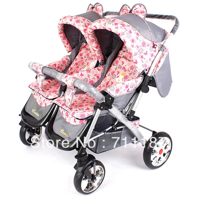 pink and blue double pushchair