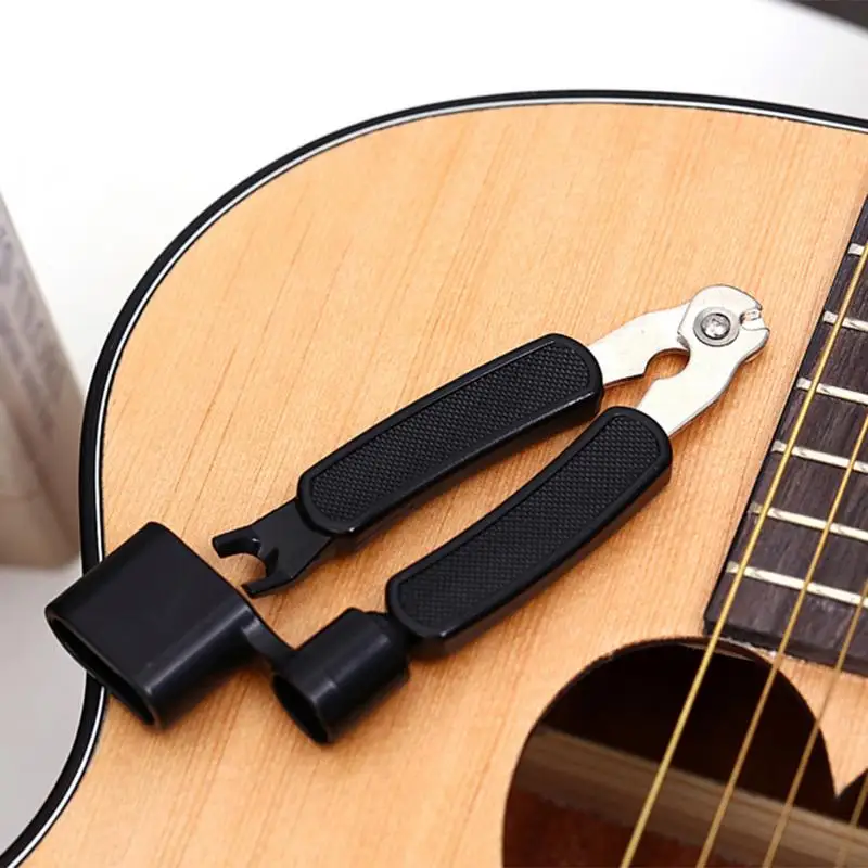

Plastic Parts + Iron Pieces Guitar Winder Manual Winding String Cutting Stringer 4 - In - 1 Ukulele Guitar Accessories