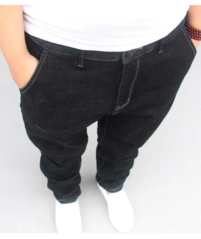 Новая мода шаровары джинсы для мужчин джинсовые брюки лоскутное размера плюс Свободные Мешковатые Черные Брюки Мужская одежда