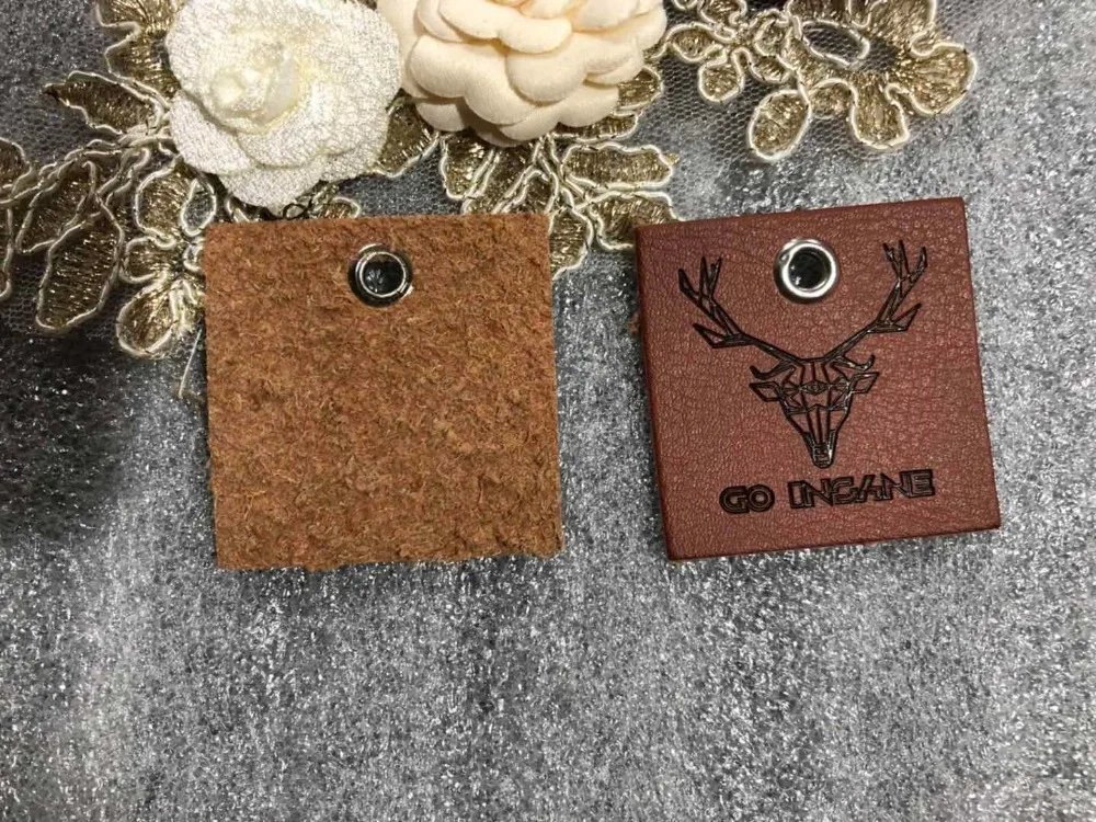 Customized leather label, PU leather label, PU patch, debossed / embossed logo leather tags with copper silver eyelet