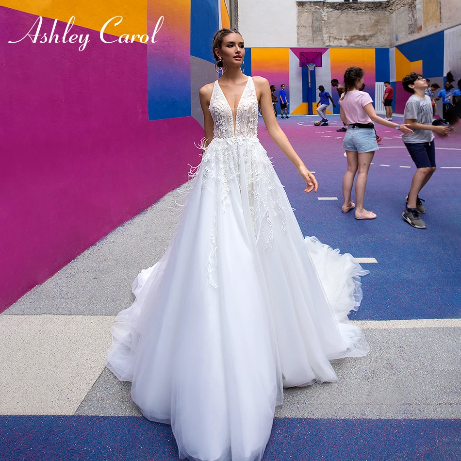 

Ashley Carol Sexy Beaded Deep V-neckline Backless Beach Boho Wedding Dress 2019 Lace Appliques Sleeveless Feathers Wedding Gowns