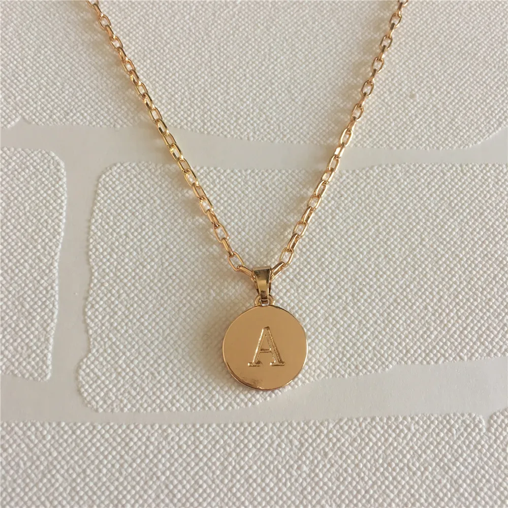 

Casual gold color letter A engraved in round disc long necklace