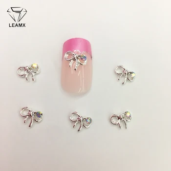 

LEAMX 10 PCS/bag AB Rhinestone Bow Nail Decoration 3D Bow Tie Nails Art Jewelry Crystal Alloy Nails Charms Manicure Decor L380