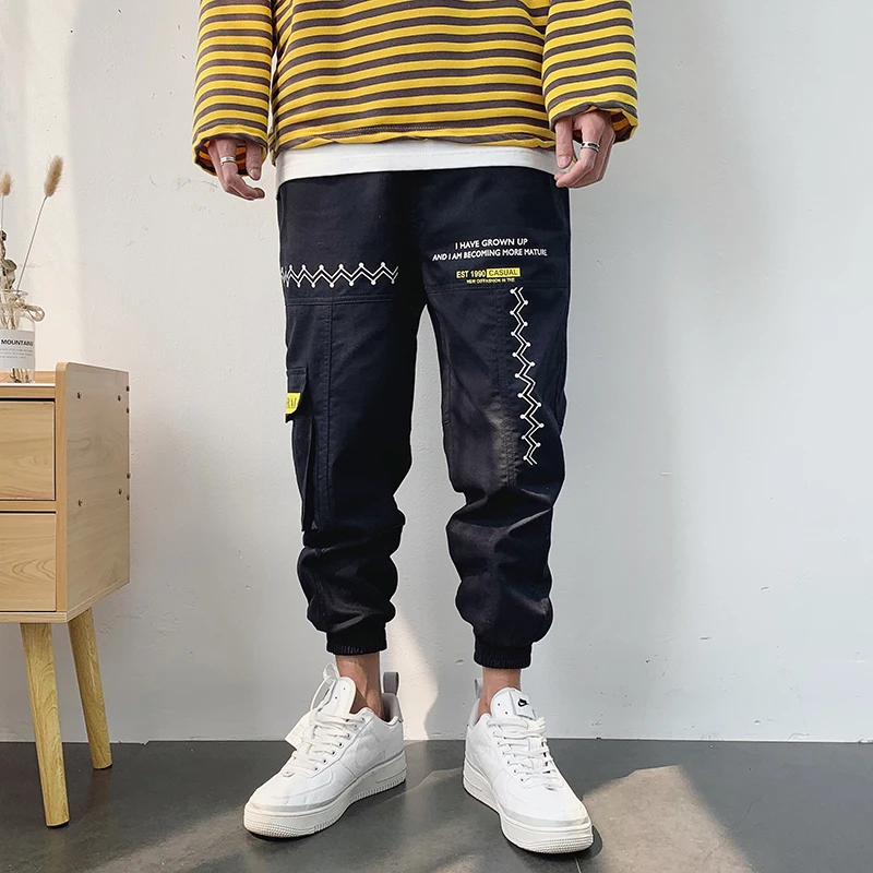 

Man Jogger Printed Pants Loose Mens Sweatpants Fashion Causal Cargo Pants Streetwear Harajuku Pockets Letter Hip Hop Trousers