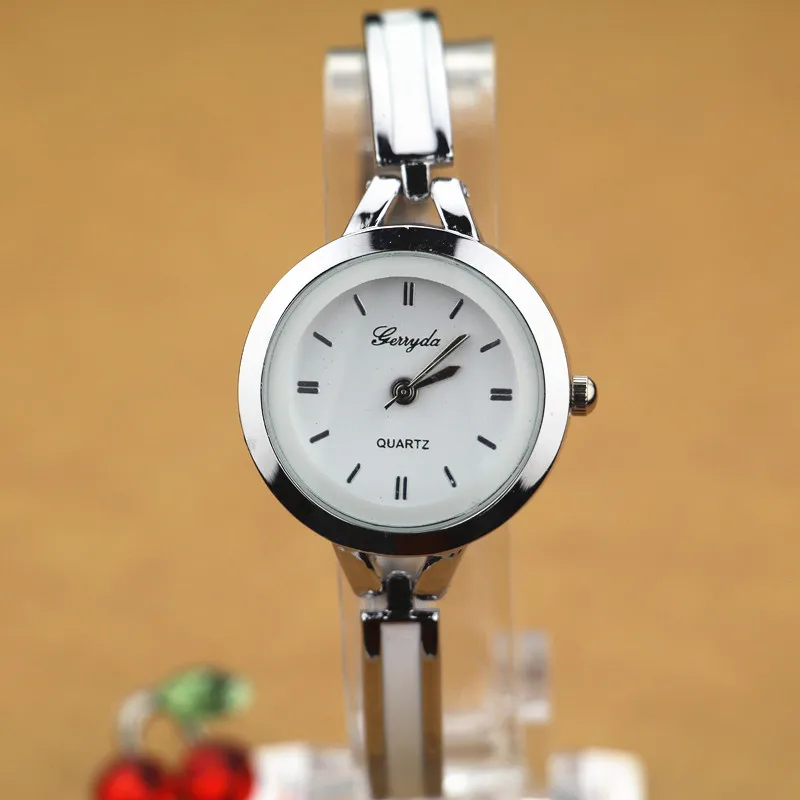 

Free shipping!bracelet style chain lady watches,gold plating alloy case,simple design dial,metal chain belt,quartz movement