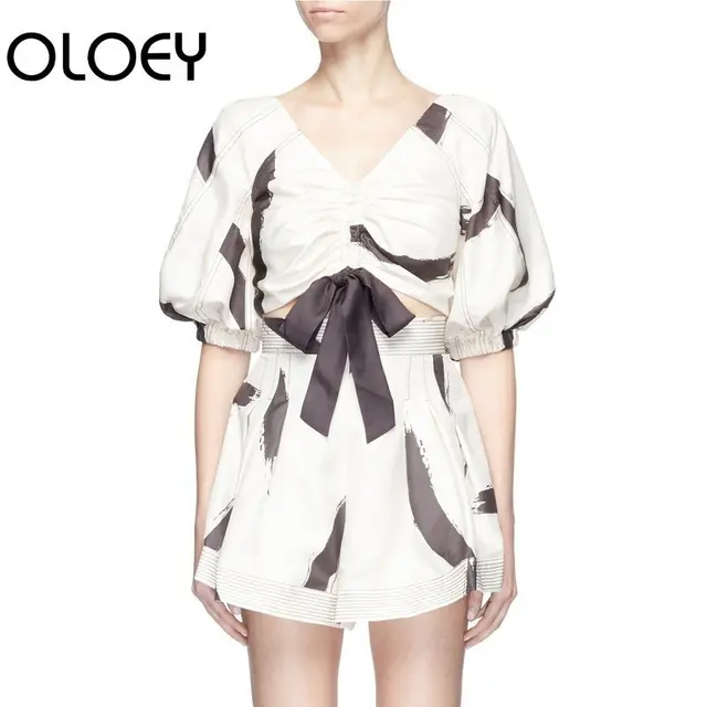 Cheap OLOEYsummer Of 2018 Fashion Sexy Two-piece Suit V-neck Zipper Lantern Sleeve Short Chiffon Shirt+print Shorts Women Set H1102 Cheap OLOEYsummer Of 2018 Fashion Sexy Two-piece Suit V-neck Zipper Lantern Sleeve Short Chiffon Shirt+print Shorts Women Set H1102