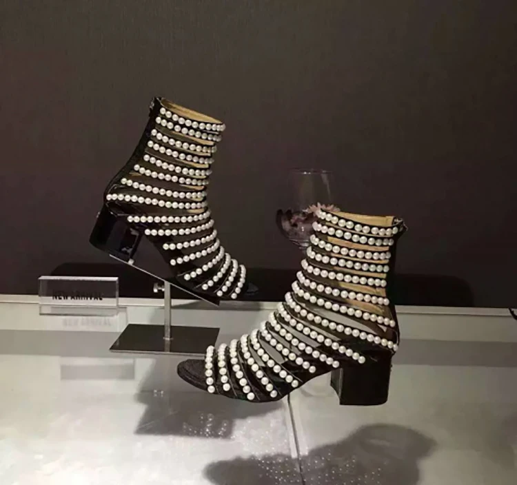 black heels with pearls on them