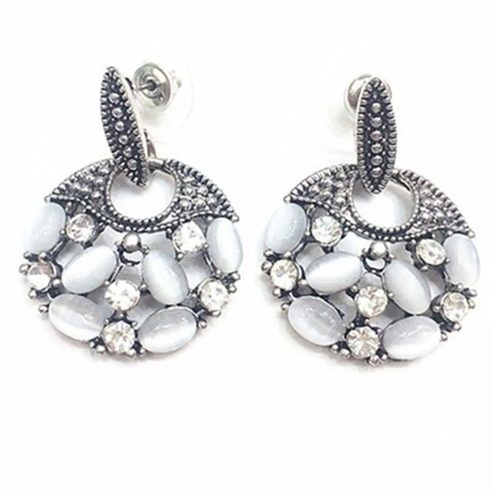 

Retro Style Earring Temperament Exaggerated Cat's Eye Stone Earrings Ethnic Style Hollow Jewelry Stud